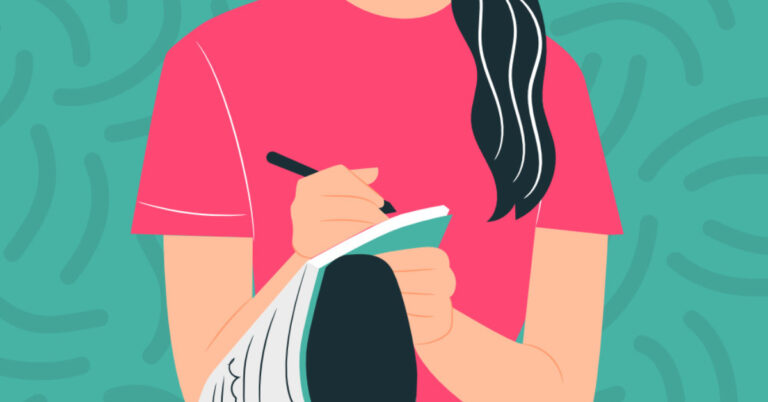 woman sitting on ground with journal and pen in hand on blue background