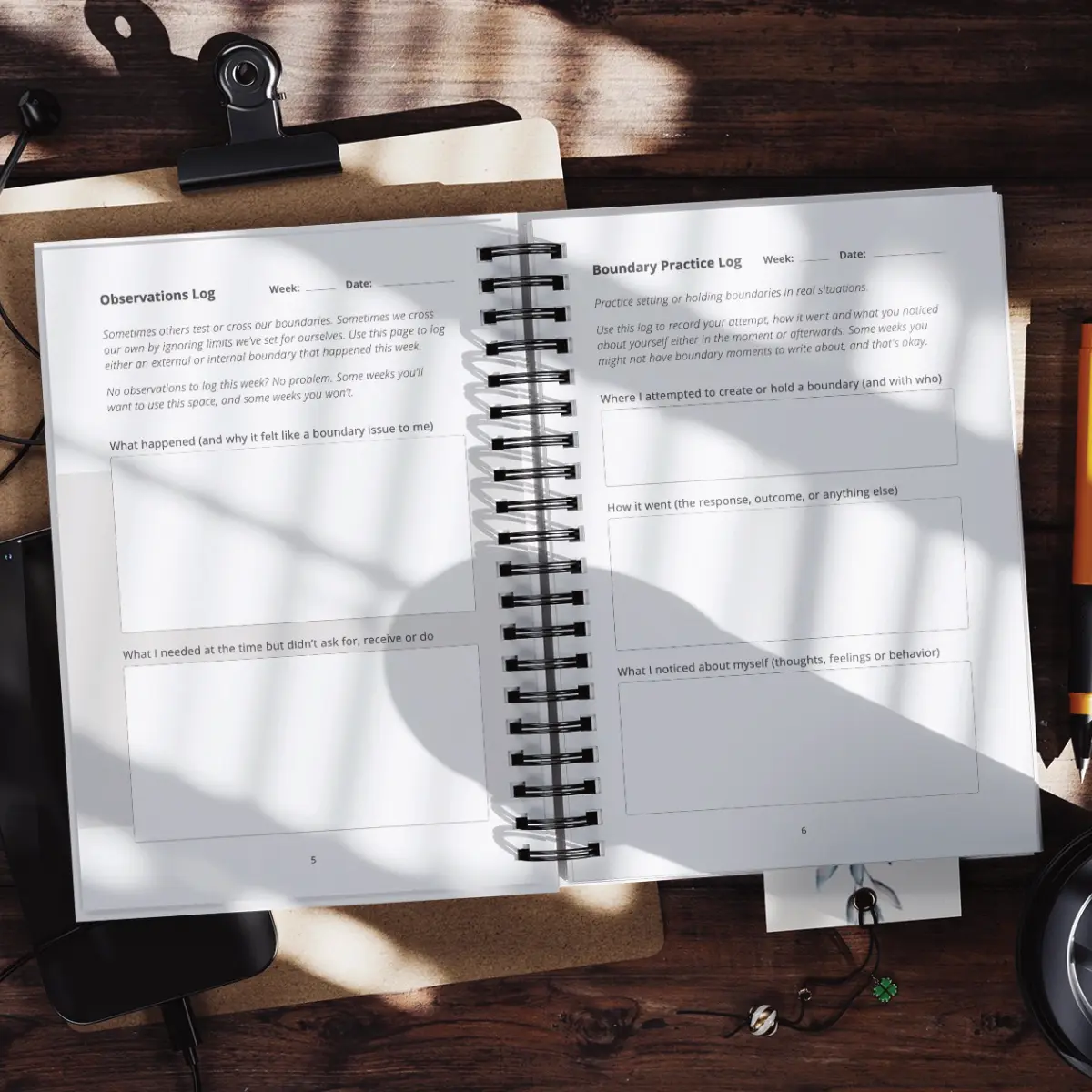 Practice Builds Boundaries journal opened on a desk, displaying structured boundary-setting prompts and weekly reflection pages.